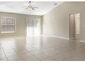 Bright and airy living room with tile flooring and lots of natural light at 13507 Willow Bluestar Loop, Riverview, FL 33579