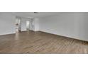 Bright and airy living room showcasing new laminate flooring and neutral walls at 4522 Marine Pkwy, New Port Richey, FL 34652