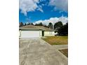 Charming single-story home with a two-car garage, set on a well-manicured front lawn at 9151 Bay Dr, Spring Hill, FL 34606