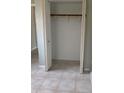 Empty closet space with neutral walls, simple shelving, and tiled floor at 814 20Th Sw St, Largo, FL 33770