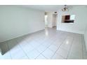 Open living room with tile floors offering views of the kitchen and bathroom at 2856 Somerset Park Dr # 102, Tampa, FL 33613