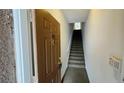 Condo entryway featuring a staircase leading to the upper level of the unit at 10519 Villa View Cir # 10519, Tampa, FL 33647
