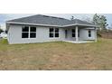 Newly built home with covered patio and spacious backyard at 13106 Nusser Ave, Weeki Wachee, FL 34614
