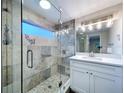 Updated bathroom with a frameless shower and modern vanity at 8531 Bass Lake Dr, New Port Richey, FL 34654