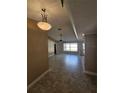 Bright living room with tile floors and view to backyard at 4152 Banbury Cir, Parrish, FL 34219