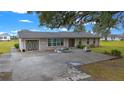 House exterior with double doors and a paved driveway at 5111 Smith Ryals Rd, Plant City, FL 33567