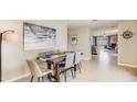 Open concept dining area with a view into the kitchen and living room at 30945 Wild Juniper Ct, Brooksville, FL 34602