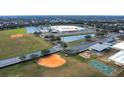 Aerial view of community featuring school, fields, and playground at 6266 Triple Tail Ct # 103, Lakewood Ranch, FL 34202