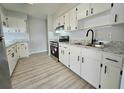 Modern kitchen with stainless steel appliances and granite counters at 12117 Topaz St, Spring Hill, FL 34608