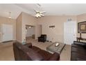 Living room features a vaulted ceiling, neutral colors, and plenty of light at 11847 Dunster Ln, Parrish, FL 34219