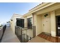 Exterior view of building with covered entry, tile roof, and unit number 307 at 6372 Palma Del Mar S Blvd # Apt 307, St Petersburg, FL 33715