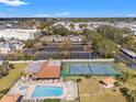 Community pool, tennis court, and parking area at 3055 Casa Del Sol Cir # 208, Clearwater, FL 33761