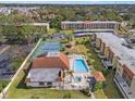 Condo community with pool, tennis court, and lush landscaping at 3055 Casa Del Sol Cir # 208, Clearwater, FL 33761