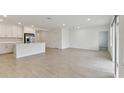 Open living space with tile floors and access to kitchen at 5213 Patano Loop, Palmetto, FL 34221