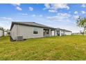 Enjoy the expansive grassy backyard of this beautiful new home, complete with a covered patio at 5217 Patano Loop, Palmetto, FL 34221