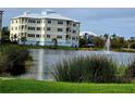 Building with water fountain and pond at 3426 79Th Street W Cir # 7-203, Bradenton, FL 34209