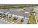 Aerial view of townhouses and a pond at 5410 Tripoli Dr, Palmetto, FL 34221