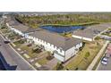 Aerial view of townhome community near a pond at 5414 Tripoli Dr, Palmetto, FL 34221