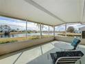 Relaxing screened porch overlooking a peaceful lake at 1718 S Pebble Beach Blvd, Sun City Center, FL 33573