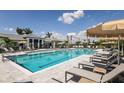 Relaxing resort-style pool with plenty of lounge chairs at 18063 Cherished Loop, Bradenton, FL 34211