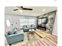 Modern living room with marble fireplace and large TV at 2217 Thrace St, Tampa, FL 33605