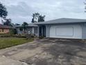 Gray house exterior with attached garage at 2275 Pine View Cir, Sarasota, FL 34231