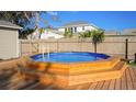 Octagonal pool with wooden deck and steps at 5340 5Th S Ave, St Petersburg, FL 33707