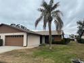 Side view of a single-story house with a carport and landscaping at 1710 Curry Ave # 42, Nokomis, FL 34275