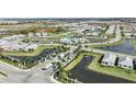 Aerial view of the community showcasing lush landscaping, serene ponds, and a variety of home styles at 17150 Savory Mist Cir, Bradenton, FL 34211