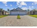 New construction home with long driveway and attached two-car garage at 18024 Cherished Loop, Bradenton, FL 34211