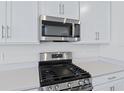 Stainless steel gas cooktop and microwave at 5943 Jensen View Ave, Apollo Beach, FL 33572
