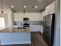 Modern kitchen with granite countertops and stainless steel appliances at 9585 Calumet Blvd, Port Charlotte, FL 33981