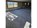 Spacious living area with large windows and tile flooring at 4903 Green Key Rd, New Port Richey, FL 34652