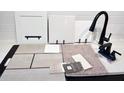 Modern kitchen features and finishes samples, including countertops, cabinets, flooring and hardware at 9157 Players Dr, Weeki Wachee, FL 34613