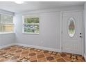 Bright entryway with tile floors and an updated door at 8514 N Mitchell Ave, Tampa, FL 33604
