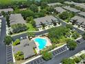 Aerial view of community with pool and townhomes at 2220 Kings Palace Dr, Riverview, FL 33578