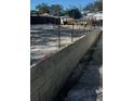 Newly poured concrete foundation with cinder blocks for new construction at 1435 17Th N Ave, St Petersburg, FL 33704