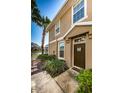 Front door entrance to townhome with landscaping at 7001 Interbay Blvd # 336, Tampa, FL 33616