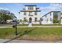 Two-story house, front yard, and walkway leading to the entrance at 1939 W Arch St, Tampa, FL 33607