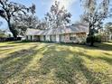 One-story home with stone accents and a well-maintained lawn at 1501 Buell Ct, Plant City, FL 33567