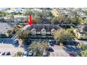 Aerial perspective of a townhome building in a residential area at 37658 Aaralyn Rd, Zephyrhills, FL 33542