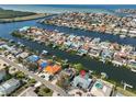 Wide aerial showcasing home's waterfront location and neighborhood at 909 Birdie Way, Apollo Beach, FL 33572