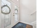 Elegant entryway with double doors and glass accents at 20233 Still Wind Dr, Tampa, FL 33647