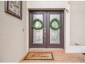 Inviting front entrance with double doors and wreaths at 20233 Still Wind Dr, Tampa, FL 33647