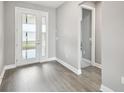 Bright foyer with gray walls and wood-look flooring at 2416 Clary Sage Dr, Spring Hill, FL 34609