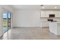 Bright dining area with sliding glass doors to backyard at 12733 Wanderlust Pl, Parrish, FL 34219