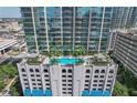 High-rise building with rooftop pool and city views at 777 N Ashley Dr # 1516, Tampa, FL 33602