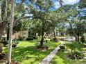 Lush landscaping surrounds a pond with fountain in this community at 315 30Th W Ave # B207, Bradenton, FL 34205