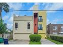 Contemporary three-story home with attached garage and city views at 212 S Moody Ave # 2, Tampa, FL 33609