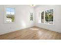 Bright bedroom with hardwood floors and large windows at 3011 W Asbury Pl, Tampa, FL 33611